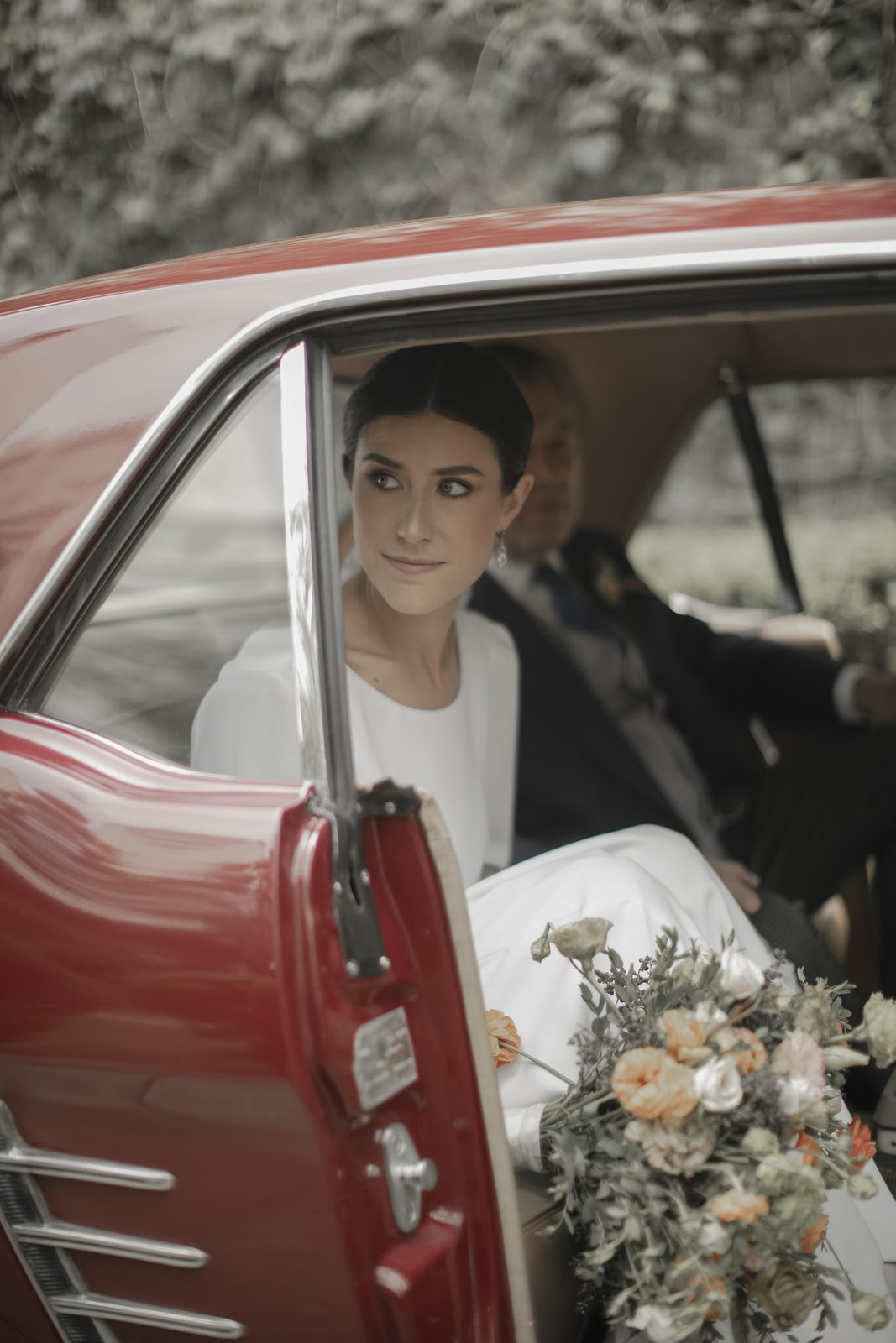 Bride in a vintage car